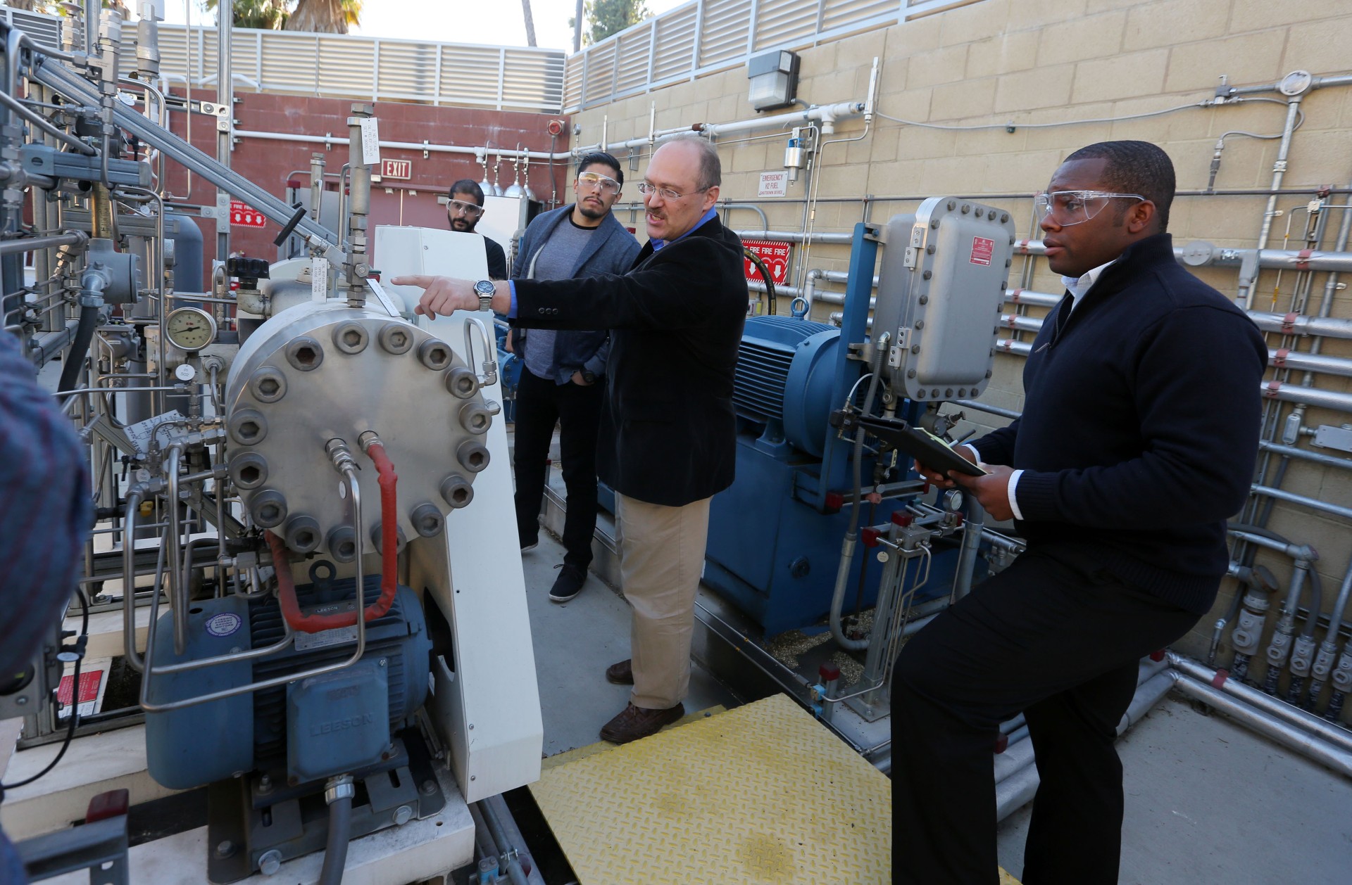 Dr. David Blekhman guides Cal State LA interns through hands-on hydrogen safety training at the Hydrogen Research and Fueling Facility (HRFF). Students learn to connect theoretical hydrogen properties directly to hazards found in operating equipment. Image credit: Dr. David Blekhman, Cal State LA
